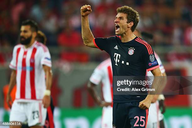 Thomas Mueller of Muenchen celebrates his team's third goal during the UEFA Champions League Group F match between Olympiacos FC and FC Bayern...