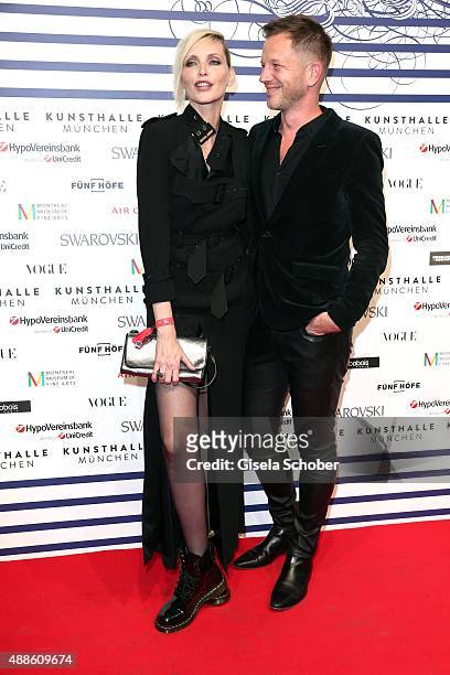 Nadja Auermann and Curator Thierry-Maxime Loriot during the opening of the exhibition Jean Paul Gaultier 'From The Sidewalk To The Catwalk' at...