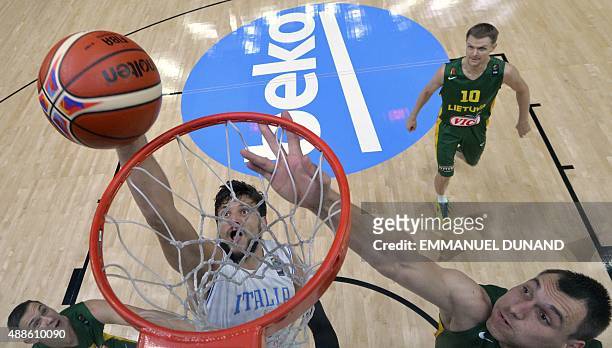 Italy's small forward Alessandro Gentile goes to the basket despite Lithuania's forward Jonas Maciulis during the round of 8 basketball match between...
