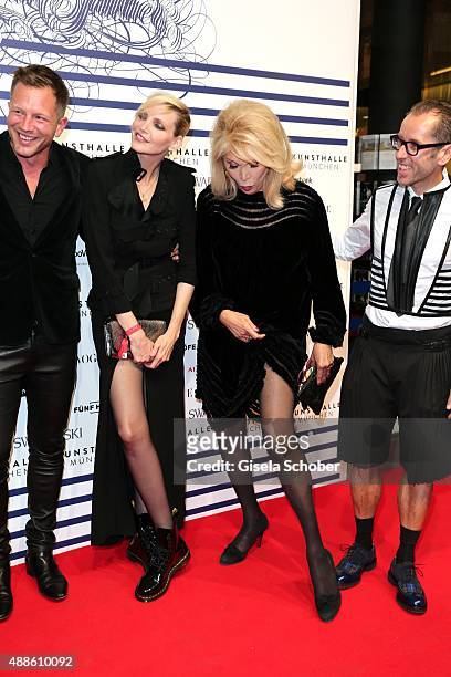 Nadja Auermann and Amanda Lear shows her leg during the opening of the exhibition Jean Paul Gaultier 'From The Sidewalk To The Catwalk' at Kunsthalle...
