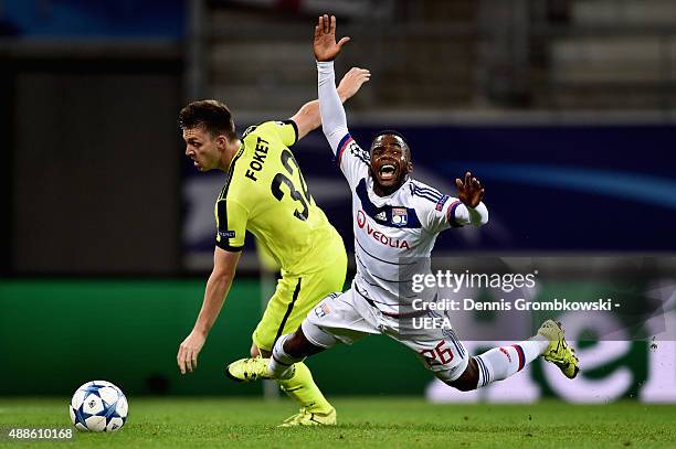 Thomas Foket of KAA Gent takes down Aldo Kalulu of Olympique Lyonnais during the UEFA Champions League Group H match between KAA Gent and Olympique...