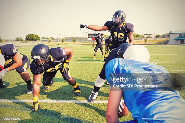 quarterback calling an audible play during semi-professional football game - quarterback stock pictures, royalty-free photos & images