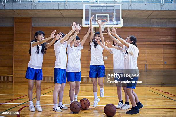 japanese basketball girls team happy after playing - japan 12 years girl stock pictures, royalty-free photos & images