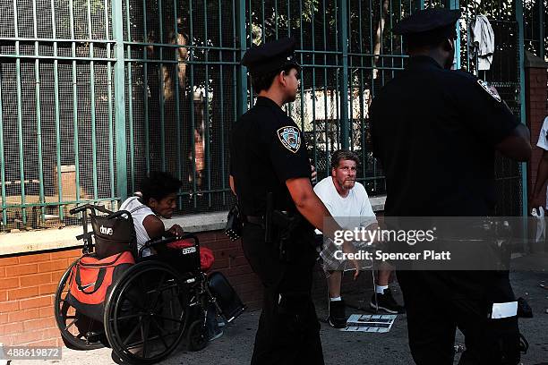 Police are viewed in an area which has witnessed an explosion in the use of K2 or 'Spice', a synthetic marijuana drug, in East Harlem on September...