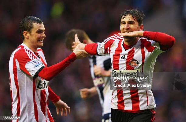 Fabio Borini of Sunderland celebrates with Adam Johnson as he scores their second goal during the Barclays Premier League match between Sunderland...