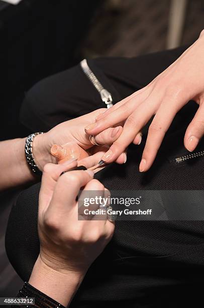 Model prepares, nail detail, backstage prior to the Marchesa fashion show during Spring 2016 New York Fashion Week at St. Regis Hotel on September...