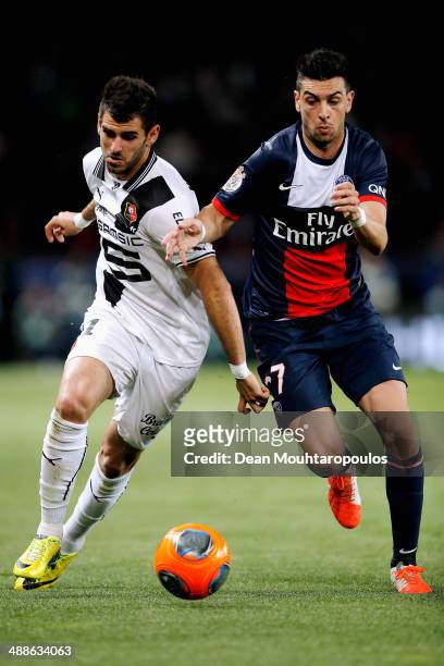 Javier Pastore of PSG and Nelson Miguel Castro Oliveira of Rennes battle for the ball during the Ligue 1 match between Paris Saint-Germain FC and...