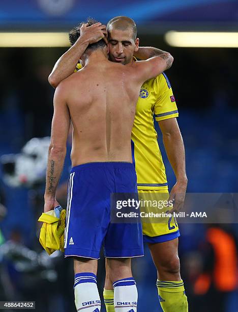 Tal Ben Haim of Maccabi Tel Aviv hugs Cesc Fabregas of Chelsea after the UEFA Champions League match between Chelsea and Maccabi Tel-Aviv at Stamford...