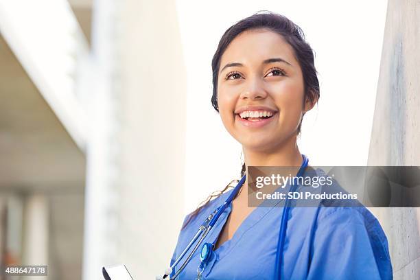 young hispanic female nursing or medical student - utbildningsbyggnad bildbanksfoton och bilder
