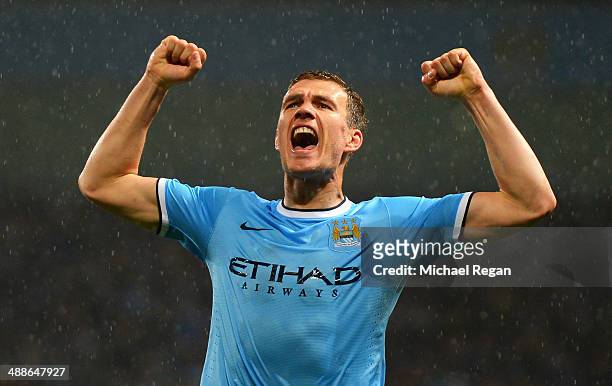 Edin Dzeko of Manchester City celebrates scoring the opening goal during the Barclays Premier League match between Manchester City and Aston Villa at...
