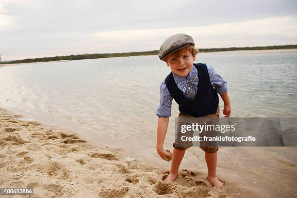little boy playing in the sand - 1950 2015 stock pictures, royalty-free photos & images