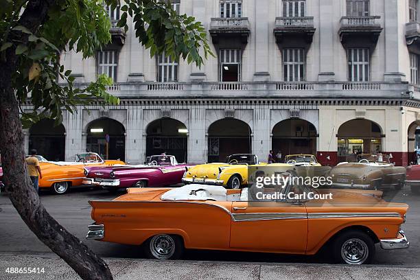 Taxi driver sits in a vintage American car on September 16, 2015 in Havana, Cuba. Pope Francis is due to make a three day visit to Cuba from...