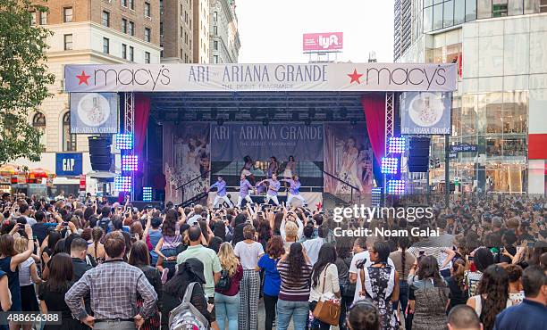 Singer Ariana Grande performs outside of Macys Herald Square at an 'ARI By Ariana Grande' fragrance launch event on September 16, 2015 in New York...