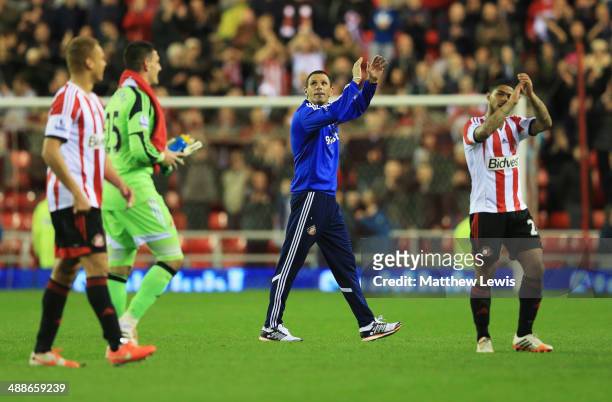 Gus Poyet manager of Sunderland celebrates victory with players after the Barclays Premier League match between Sunderland and West Bromwich Albion...