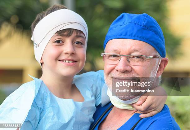 little patient and the doctor - head bandage stock pictures, royalty-free photos & images