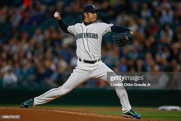 Starting pitcher Hisashi Iwakuma of the Seattle Mariners pitches against the Los Angeles Angels of Anaheim in the first inning at Safeco Field on...