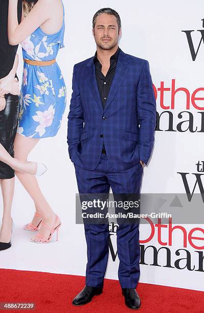 Actor Taylor Kinney arrives at the Los Angeles premiere of 'The Other Woman' at Regency Village Theatre on April 21, 2014 in Westwood, California.