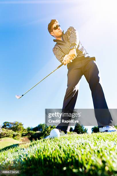 young golfer lining up shot on golf course - teeing off stock pictures, royalty-free photos & images