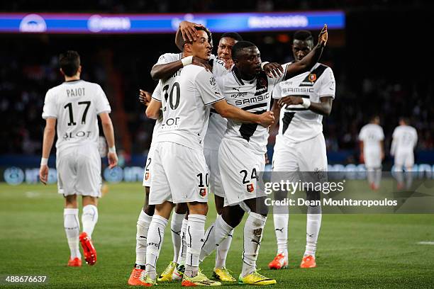 Foued Kadir of Rennes celebrates with team mates after scoring his teams first goal during the Ligue 1 match between Paris Saint-Germain FC and Stade...