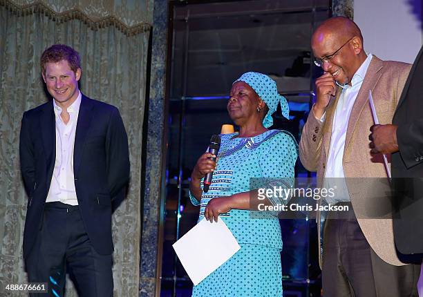 Prince Harry, Malineo Motsephe, who received the Service award and Sentebale founding patron Prince Seeiso Bereng Seeiso on stage during the...