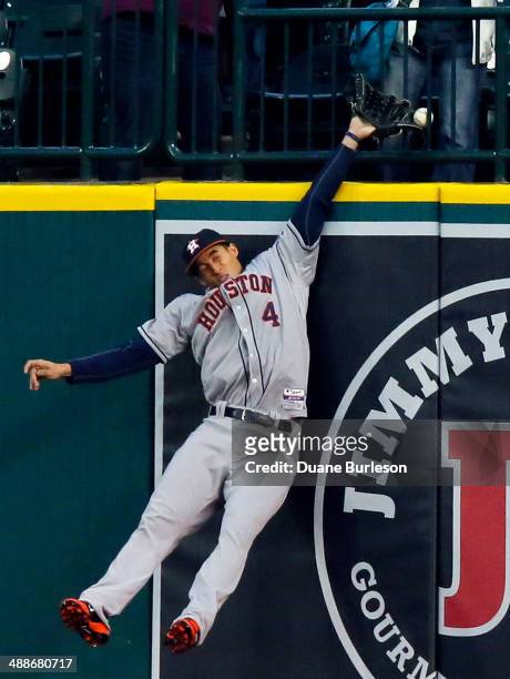 Right fielder George Springer of the Houston Astros gets his glove on the home run hit by Miguel Cabrera of the Detroit Tigers but can't haul it in...