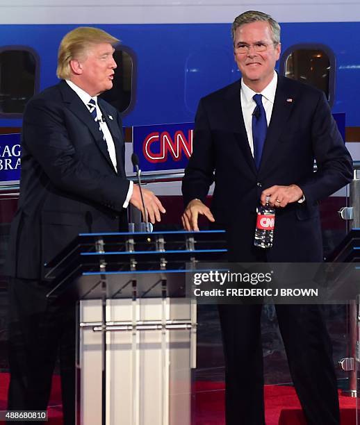 Republican presidential hopefuls Donald Trump and Jeb Bush speak during the Republican presidential debate at the Ronald Reagan Presidential Library...