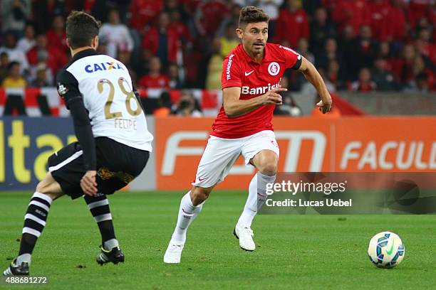 Alex of Internacional battles for the ball against Felipe of Corinthians during the match between Internacional and Corinthians as part of...
