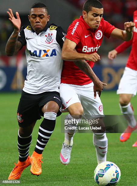 Willian of Internacional battles for the ball against Malcom of Corinthians during the match between Internacional and Corinthians as part of...