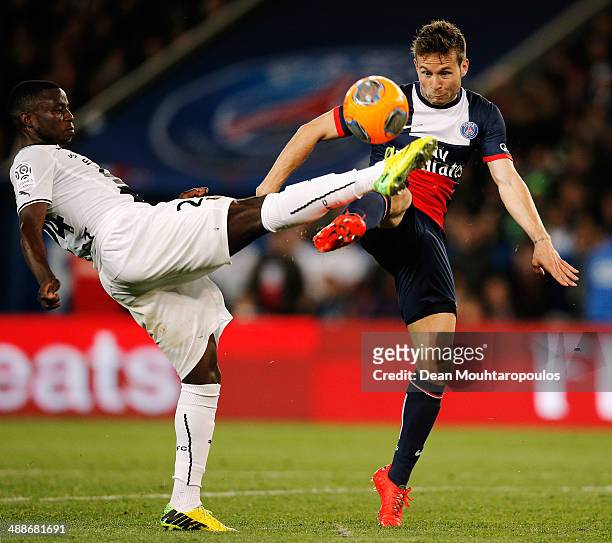 Yohan Cabaye of PSG and Paul-Georges Ntep de Madiba of Rennes battle for the ball during the Ligue 1 match between Paris Saint-Germain FC and Stade...