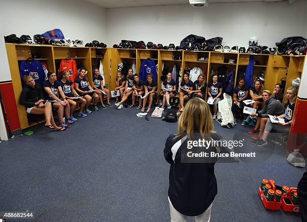 General Manager Dani Rylan of the New York Riveters of the National Womens Hockey League speaks with her players at the Aviator Sports & Events...