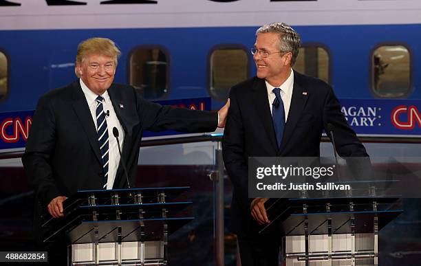 Republican presidential candidates Donald Trump and Jeb Bush take part in the presidential debates at the Reagan Library on September 16, 2015 in...