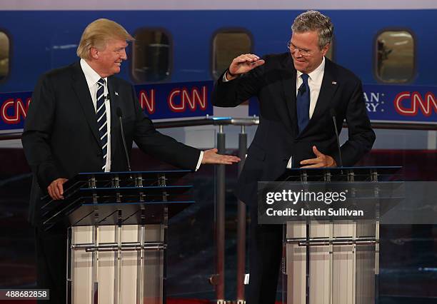 Republican presidential candidates Donald Trump and Jeb Bush take part in the presidential debates at the Reagan Library on September 16, 2015 in...