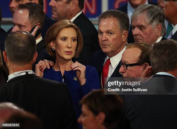 Republican presidential candidate Carly Fiorina walks with her husband Frank Fiorina at the presidential debates at the Reagan Library on September...