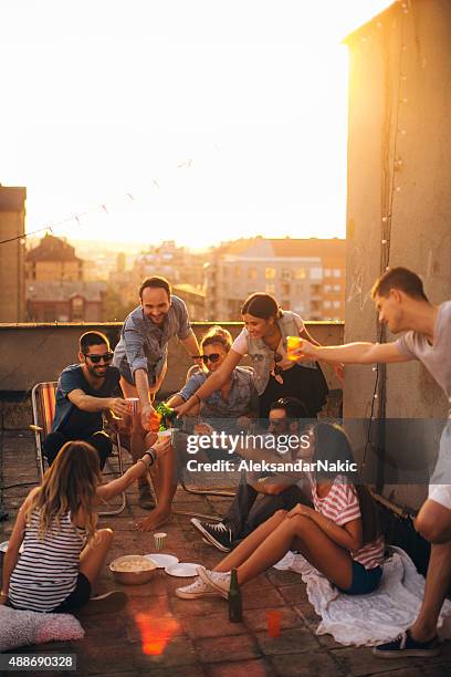 cheers! - rooftop party stock pictures, royalty-free photos & images