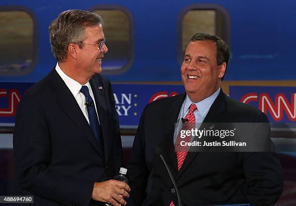 Republican presidential candidates, New Jersey Gov. Chris Christie and Jeb Bush talk during the presidential debates at the Reagan Library on...