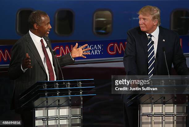 Republican presidential candidate Donald Trump looks on as Ben Carson speaks during the presidential debates at the Reagan Library on September 16,...