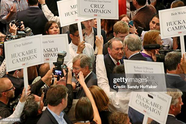 Republican presidential candidate Mike Huckabee speaks with reporters after the presidential debate at the Reagan Library on September 16, 2015 in...