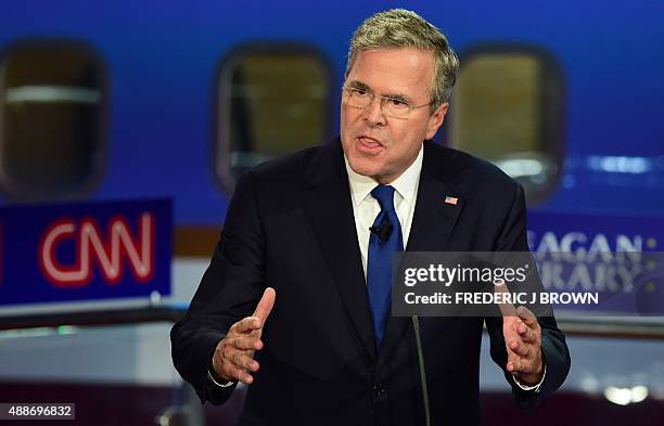 Republican presidential hopeful, former Florida Gov. Jeb Bush, gestures while speaking during the Presidential debate at the Ronald Reagan...