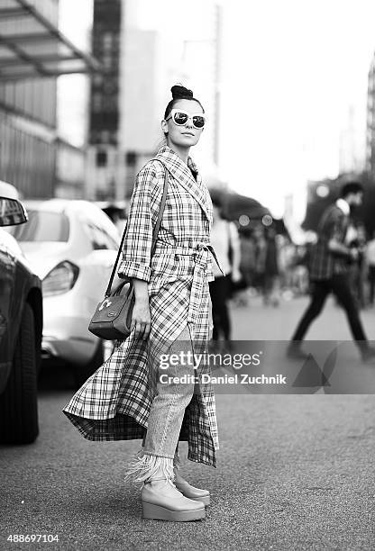 Marta Pozzan is seen outside the DKNY show wearing a Breelayne coat during New York Fashion Show 2016 on September 16, 2015 in New York City.