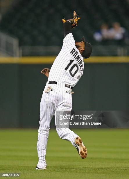 Alexei Ramirez of the Chicago White Sox makes an over-the-shoulder catch on a ball hit by Welington Castillo of the Chicago Cubs on the first out of...