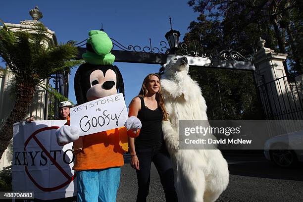 Activists opposed to the Keystone XL Canada-to-Texas pipeline project enter the the exclusive neighborhood of Bel-Air to rally outside a USC Shoah...