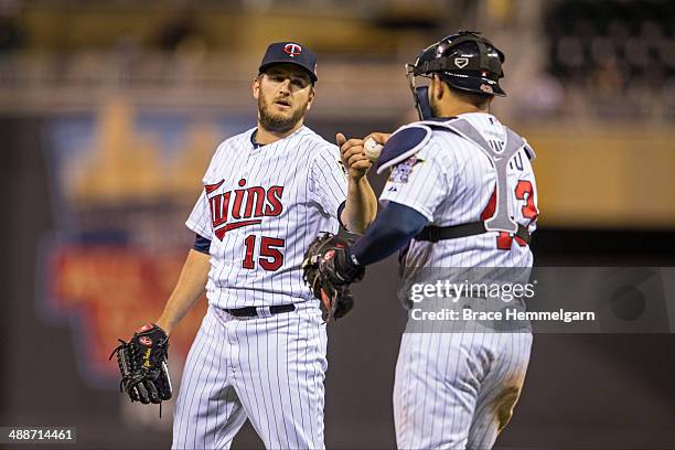 Glen Perkins of the Minnesota Twins celebrates with Josmil Pinto against the Toronto Blue Jays on April 17, 2014 at Target Field in Minneapolis,...