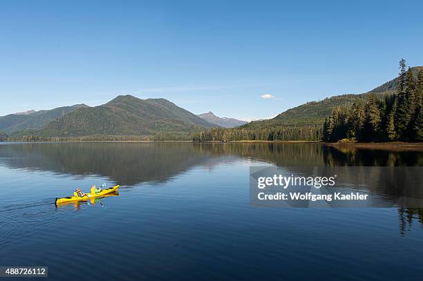 People kayaking in Hobart Bay off Stephens Passage in Tongass National Forest, Southeast Alaska, USA.