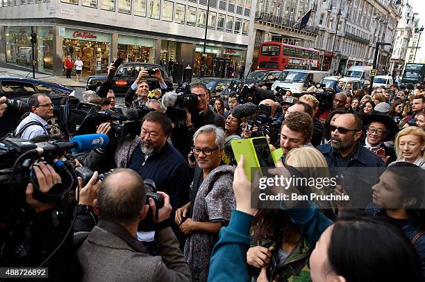 Ai Weiwei and Anish Kapoor speak to the media as they depart the Royal Academy as they walk through the city as part of a march in solidarity with...