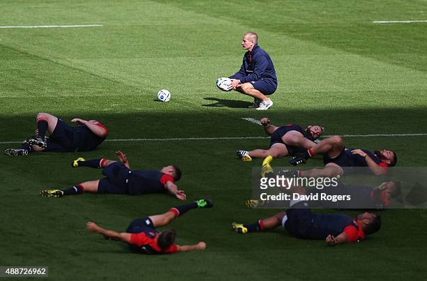 Stuart Lancaster Head Coach of England looks on as players stretch during the England Captain's Run on the eve of the opening Rugby World Cup 2015...