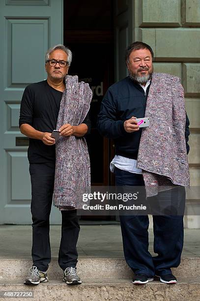 Anish Kapoor and Ai Weiwei pose for members of the press at the Royal Academy ahead of their walk through the city as part of a march in solidarity...