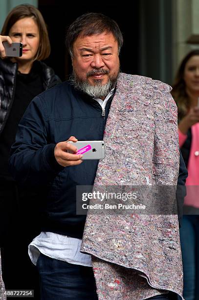 Ai Weiwei departs the Royal Academy as he walk through the city as part of a march in solidarity with migrants currently crossing Europe on September...