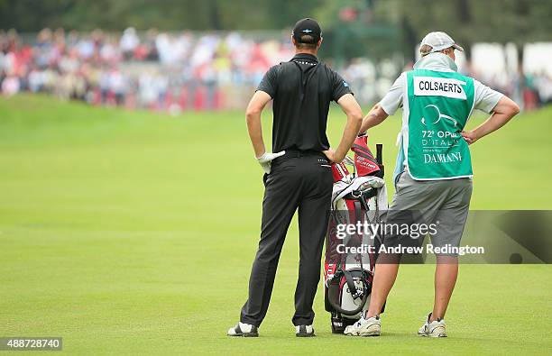 Nicolas Colsaerts of Belgium waits with his caddie Brian Nilsson on the ninth hole during the first round of the 72nd Open d'Italia at Golf Club...