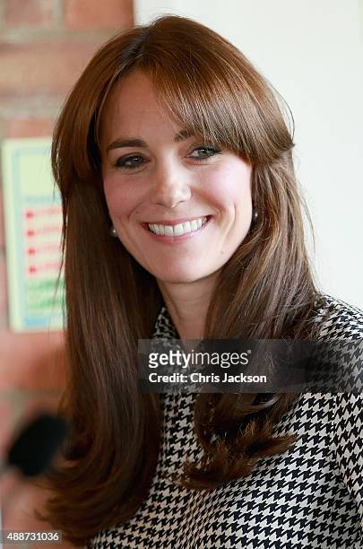 Catherine, Duchess of Cambridge laughs as she visits the Anna Freud Centre on September 17, 2015 in London, England. The visit was for the Duchess to...