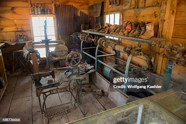 The interior of a shoemaker shop with an old Singer sewing machine at the historic Gold King Mine and Ghost Town from the 1890s outside of Jerome in...